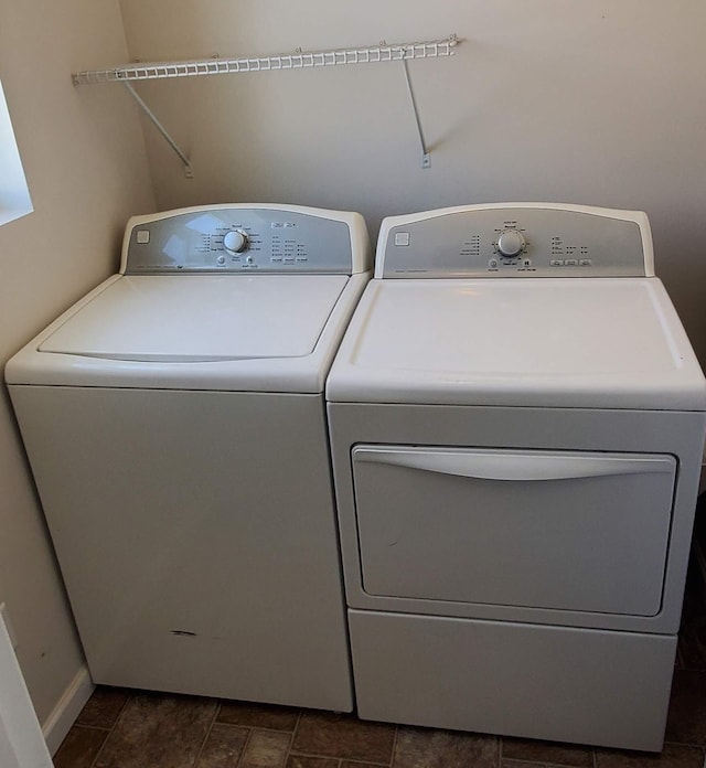 washroom featuring tile patterned floors and washer and clothes dryer