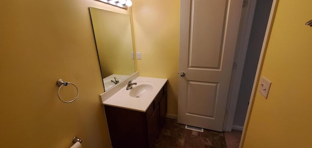 bathroom with tile patterned flooring and vanity