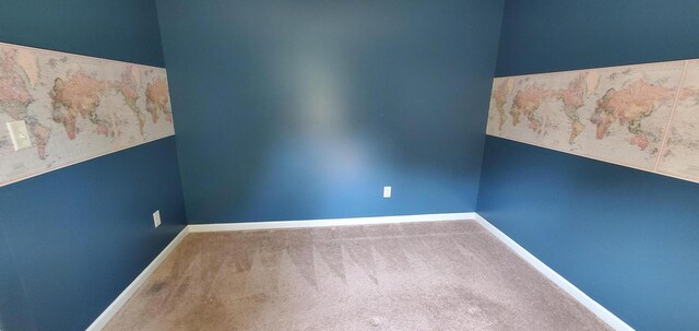 spare room featuring carpet flooring