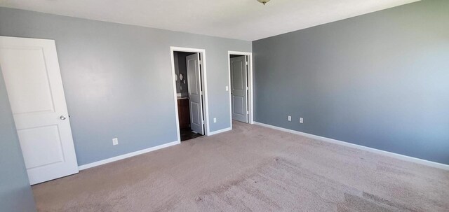 unfurnished bedroom with carpet flooring