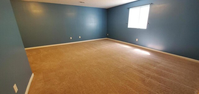 unfurnished room featuring carpet floors