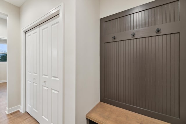 mudroom with light hardwood / wood-style flooring