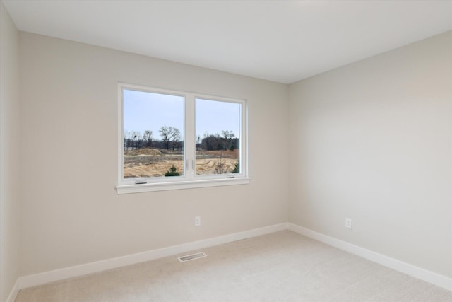 empty room featuring carpet flooring