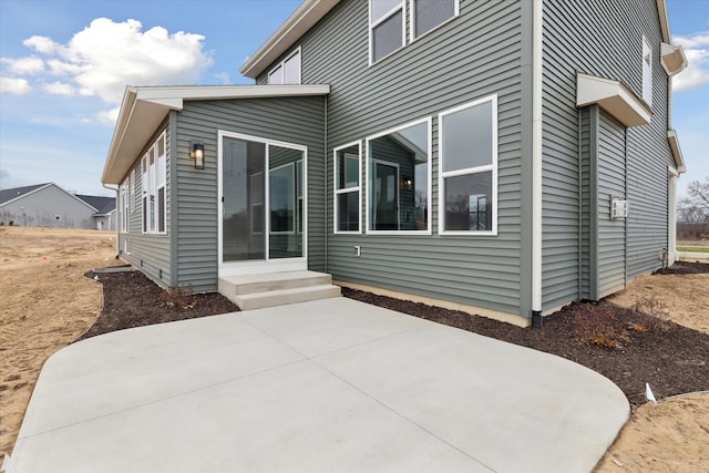 back of house with a patio