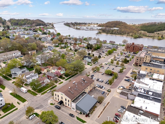 drone / aerial view with a water view