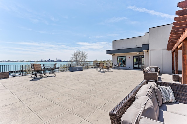 view of patio / terrace featuring a water view and an outdoor hangout area