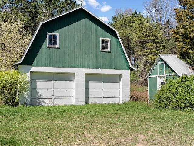 garage with a yard