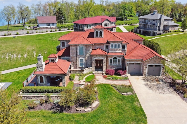 view of front of home featuring a garage and a front yard