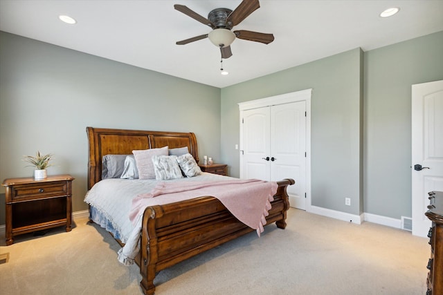 bedroom featuring a closet, ceiling fan, and carpet flooring