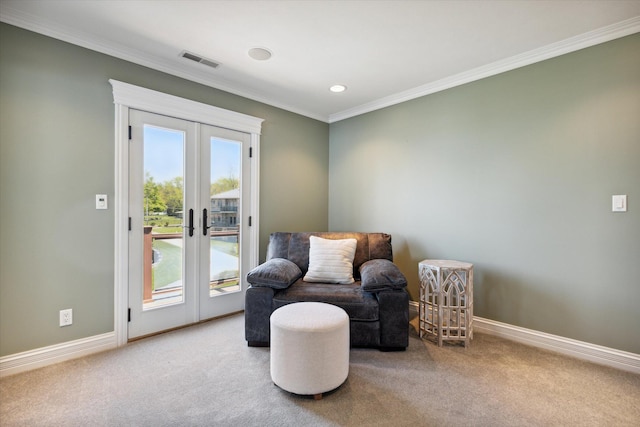 living area with french doors, carpet, and ornamental molding