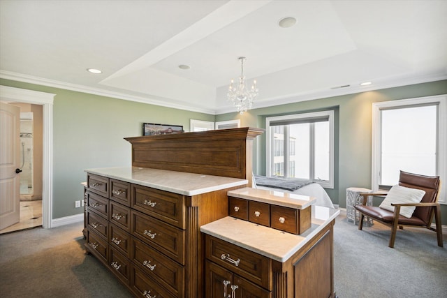 bedroom with a chandelier, dark colored carpet, a raised ceiling, and ornamental molding