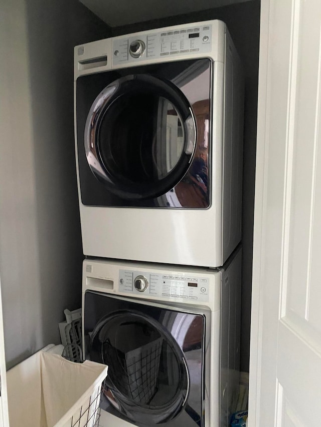 washroom with stacked washer and clothes dryer