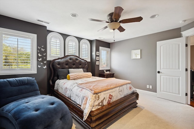 bedroom featuring ceiling fan and carpet