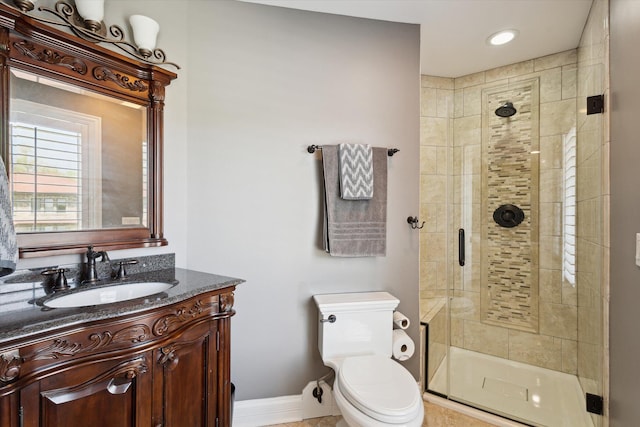 bathroom with a shower with shower door, toilet, and oversized vanity