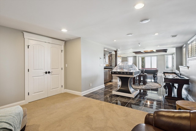 living room with dark colored carpet