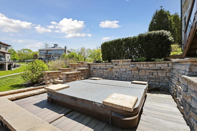 wooden terrace with a covered hot tub