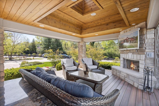 view of terrace featuring an outdoor living space with a fireplace