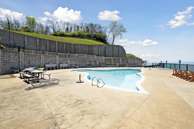 view of swimming pool with a patio