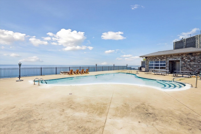 view of swimming pool featuring a patio area