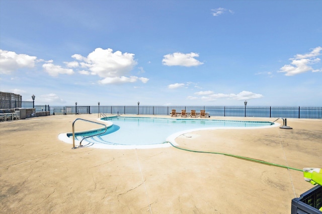 view of swimming pool with a patio