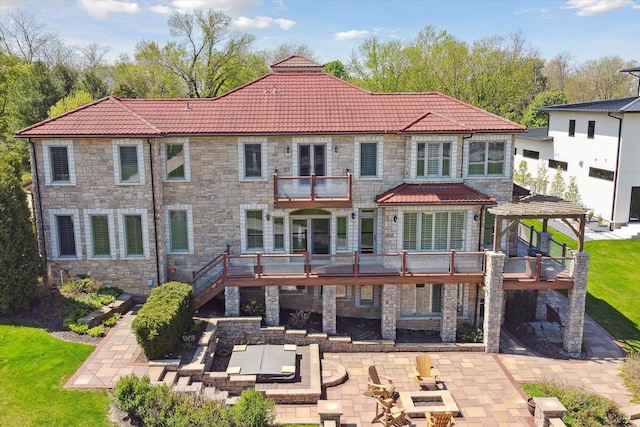 rear view of property featuring a patio area