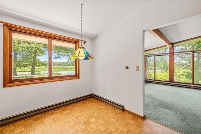 unfurnished dining area featuring vaulted ceiling with beams, light parquet flooring, and baseboard heating