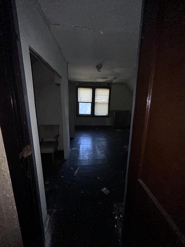 hallway featuring a textured ceiling