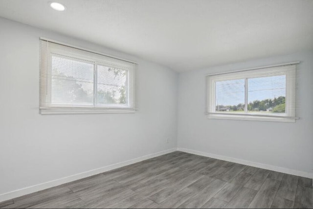 empty room featuring hardwood / wood-style flooring