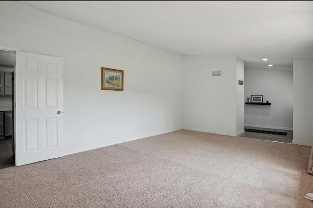 unfurnished room featuring carpet