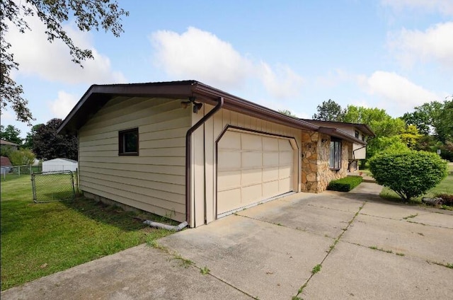 garage featuring a yard