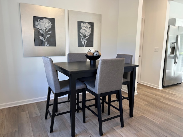 dining room featuring light wood-type flooring