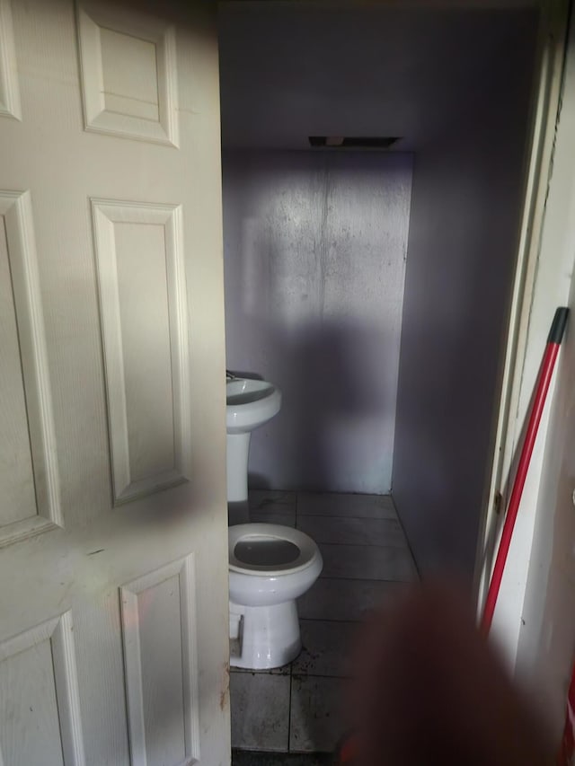 bathroom featuring toilet