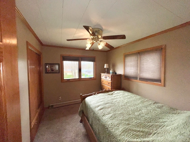 bedroom with ceiling fan, carpet floors, and baseboard heating