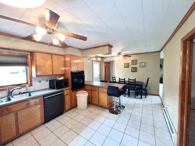 kitchen with a baseboard radiator, black appliances, sink, ceiling fan, and light tile floors