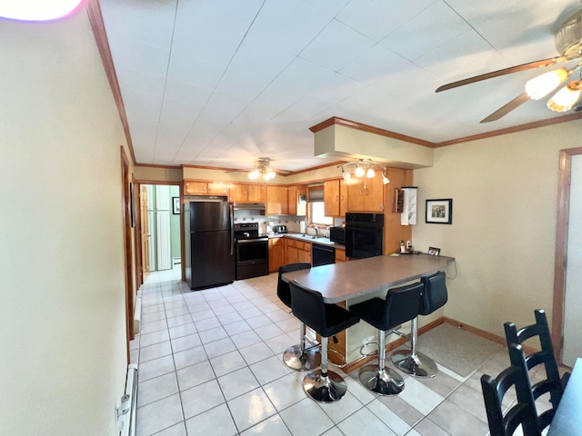 kitchen with ceiling fan, crown molding, light tile flooring, and black appliances