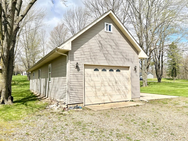 garage featuring a yard