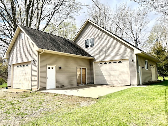 exterior space featuring a front yard and a garage