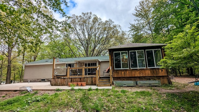 view of front of property featuring a wooden deck