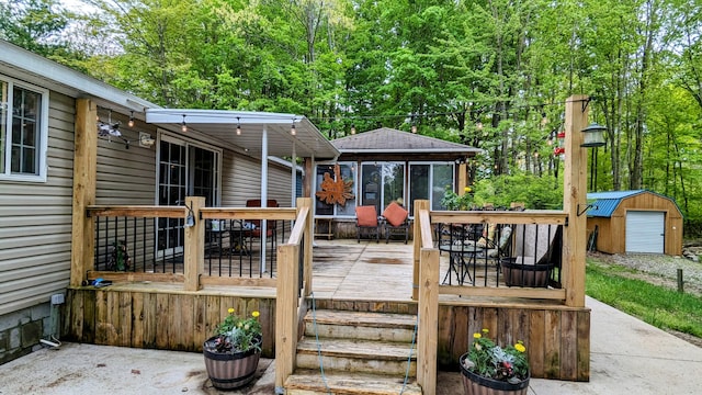 deck featuring a shed and a patio