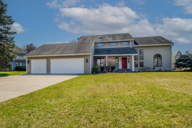 view of front of property featuring a garage and a front lawn