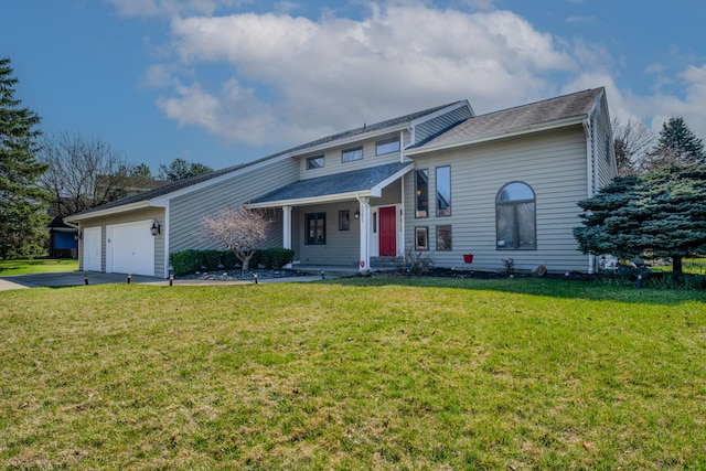 view of front of property featuring a garage and a front yard