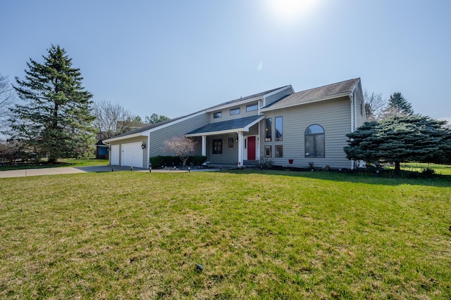 front facade featuring a garage and a front lawn