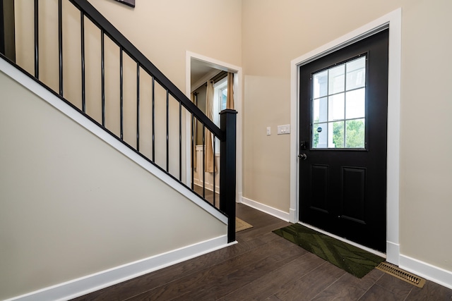 entrance foyer featuring dark hardwood / wood-style floors