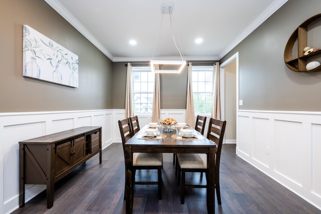 dining area with dark wood-type flooring and ornamental molding