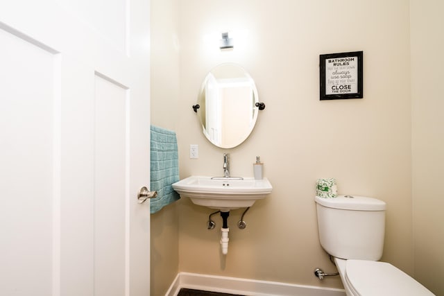 bathroom with sink and toilet