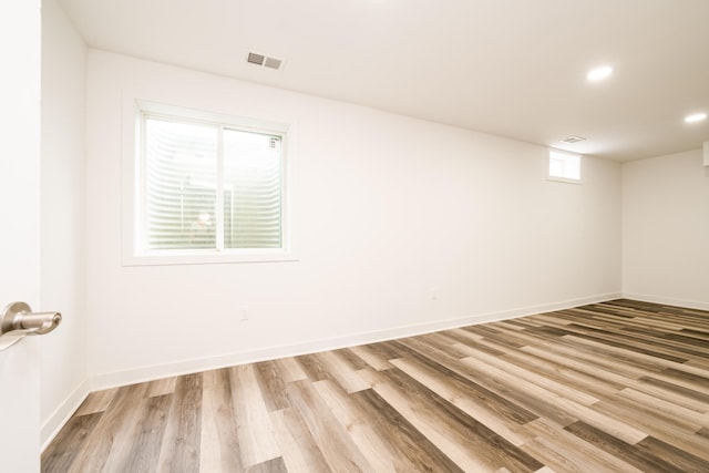 unfurnished room with light hardwood / wood-style floors