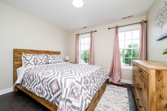 bedroom featuring dark hardwood / wood-style flooring