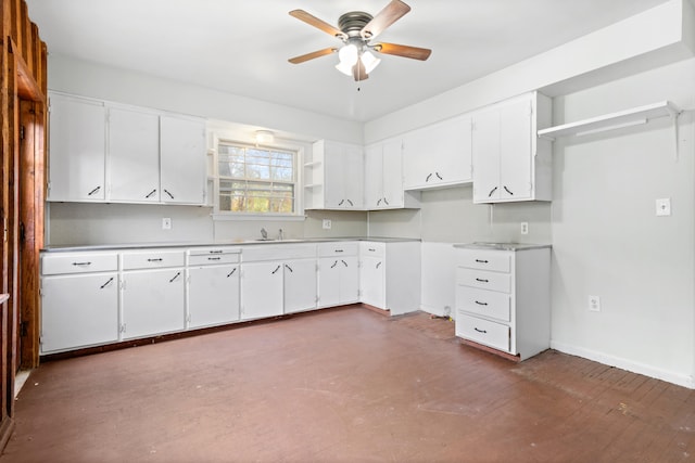 kitchen with sink, white cabinets, tasteful backsplash, and ceiling fan