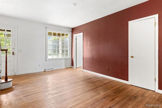 spare room with light hardwood / wood-style floors