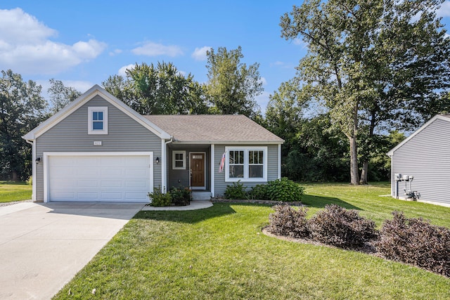 view of front facade featuring a garage and a front lawn